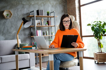 Sticker - Photo of confident serious lady wear orange sweater reading report typing modern device indoors workshop workplace workstation