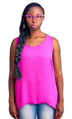 Poster - Young african american woman wearing casual clothes and glasses depressed and worry for distress, crying angry and afraid. sad expression.