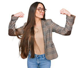 Sticker - Young hispanic girl wearing business clothes and glasses showing arms muscles smiling proud. fitness concept.