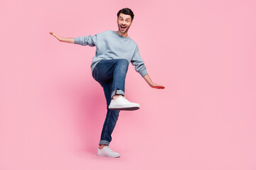 Sticker - Full size photo of young funny grimace excited guy student wear grey jumper jeans crazy dance celebrate salary holidays isolated on pink color background