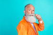 © deagreez - Profile photo of confident aged person hand touch fix mustache look empty space isolated on teal color background