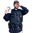 © Krakenimages.com - Young handsome man with beard wearing police uniform holding question mark stressed and frustrated with hand on head, surprised and angry face