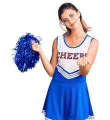 Sticker - Young beautiful woman wearing cheerleader uniform smiling cheerful offering palm hand giving assistance and acceptance.