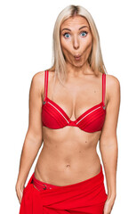 Sticker - Young blonde woman wearing bikini scared and amazed with open mouth for surprise, disbelief face