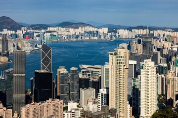 Poster - Scenic bird's eye view of the beautiful Victoria harbor in Hong Kong on a summer day