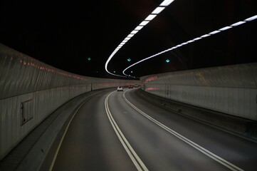 Sticker - Modern curving tunnel with cars and illuminated lights