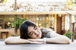 © memorystockphoto - Portrait of young beautiful asian woman sleep relax in the table. Close up smile happy asian girl sitting the garden morning time. Lifestyle beauty concept. beautiful asian woman. happy girl