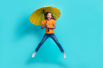 Sticker - Full body length photo of young cute preteen girl wear casual outfit windy rainy forecast wrong hold parasol excited isolated on aquamarine color background