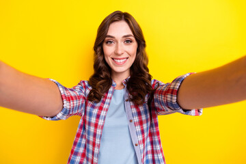 Sticker - Closeup selfie photo of young adorable lady wear checkered shirt take shot toothy beaming smile enjoy lifestyle isolated on yellow color background