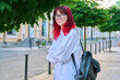 © Valerii Honcharuk - Portrait of smiling female student 18, 19 years old on city street