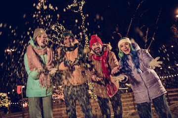 Poster - Photo of young excited people wear warm coats jackets throwing snow camera near big capital center tree buy more christmas souvenirs outdoors