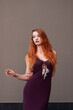 © pliekhova - Portrait of lovely slim redhead girl in wine dress and dreamcatcher craft talisman
