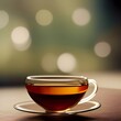 Calming image featuring a hot beverage such as herbal tea in a clear glass teacup with an ambient lighting bokeh background. May represent rest and relaxation, herbal remedy, tranquility, good health.