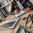 © Svitlana - Cropped IT technician editing scheme with pencil