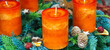 New Advent wreath with real orange candles and Christmas decorations