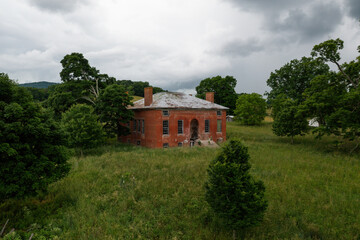 Wall Mural - Abandoned Georgian Revival House - Historic Brick Building with Four Chimneys and Standing Seam Tin Roof - Sweet Springs, West Virginia