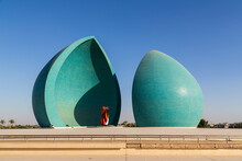 Baghdad, Iraq - November 2022: Split Turquoise Domes Of Al Shaheed War Memorial Also Called As Martyr's Monument At The Centre Of The Two Half-domes Is The Iraqi Flag
