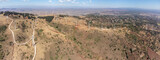 Fototapeta Sawanna - Panoramic aerial view of wind turbines or windmills in Kenya near Nairobi.
