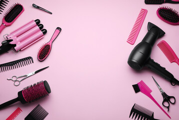 Wall Mural - Flat lay composition with modern hair dryer and triple curling iron on pink background, space for text