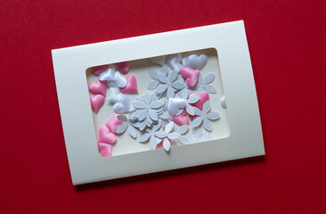 Sticker - retro paper card with paper confetti florals and fabric hearts on red