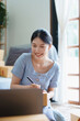 © Jirapong - Starting small business entrepreneur of independent young Asian woman online seller is using computer and taking orders to pack products for delivery to customers. SME delivery concept