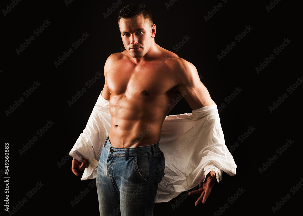 Man take off shirt. Mens fashion concept. Muscular shirtless manked man ...