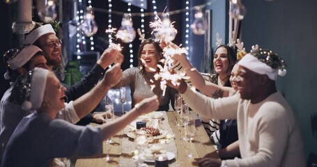 Poster - Christmas friends, sparks and celebration at dinner party, house and night. Happy, smile or excited group of festive people celebrate holiday event, fireworks and social gathering in dark dining room