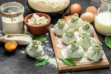 Wall Mural - Georgian dumplings Khinkali with cheese and spinach. Raw semi-finished products dumplings. banner, menu, recipe place for text, top view