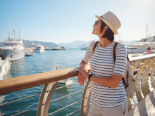 Marmaris Is Resort Town On Turkish Riviera, Also Known As Turquoise Coast. Marmaris Is Great Place For Sailing And Diving. Asian Woman With Hat Walking On Pier In Harbor.