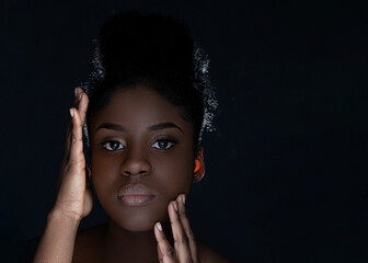 african american black beauty on black background, with attractive healthy smooth skin, shiny, clean