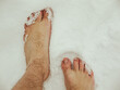 a man walks barefoot in the snow, hardening and a healthy lifestyle
