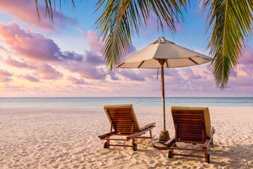 Fantastic beach. Couple chairs sandy beach sea. Luxury summer holiday and vacation resort hotel for tourism. Inspirational tropical landscape. Tranquil scenery, relax beach, beautiful landscape design