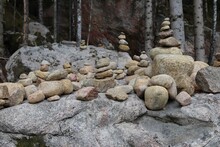 Balancing Stones Stacked On A Big Stone