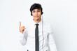 © luismolinero - Telemarketer man working with a headset isolated on white background pointing with the index finger a great idea