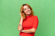 © luismolinero - Young caucasian woman isolated on green screen chroma key background thinking an idea