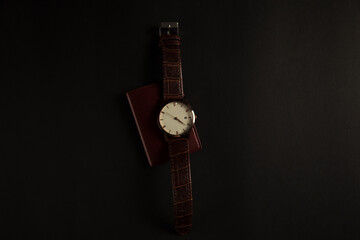 wristwatches and leather wallets