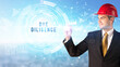 © ra2 studio - Handsome businessman with helmet drawing