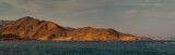 Fototapeta Kuchnia - Panoramic landscape of Taba with mountain ranges and beautiful cloudy sky at sunset.
