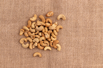 Sticker - cashew nuts on burlap with copy space