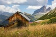 Scenic view of a small wooden hut found outdoors with beautiful mountains in the background