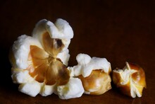 Macro Photography With Popcorn; Blooming Corn Kernels On A Dark Background