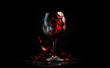 Broken wineglass on black background. Shattered wine glass with red wine. Red vine splash out broken glass. Broken wine glass illustration.