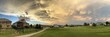 Panoramic view of the countryside with houses under the sky with a beautiful cloudscape