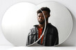 © Clique Images - Horizontal creative two round mirrors reflection portrait shot of modern young African American man wearing black leather shirt, copy space