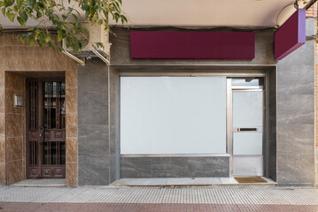 Wall Mural - Commercial premises with a gray marble facade on the street with two-tone floors