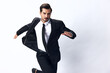 © SHOTPRIME STUDIO - A business man jumps in a business suit and smiles with his teeth on a white isolated background running. The concept of a happy businessman