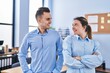 © Krakenimages.com - Man and woman business workers smiling confident standing with arms crossed gesture at office