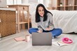 © Krakenimages.com - Young caucasian woman student studying on floor having video call at bedroom