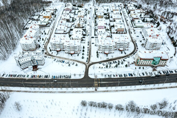 Wall Mural - winter scenery with private houses in suburb. homes covered with snow after snowfall. aerial view.