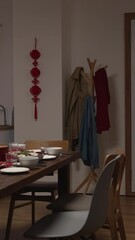 Wall Mural - Vertical Screen: cozy home interior with spring couplet and dinner table of food celebrating chinese lunar new year. word on door and wall translation: spring and congratulations